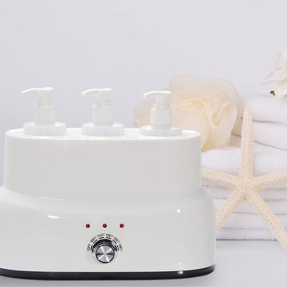 White electric warmer with three pump bottles on a light gray background
