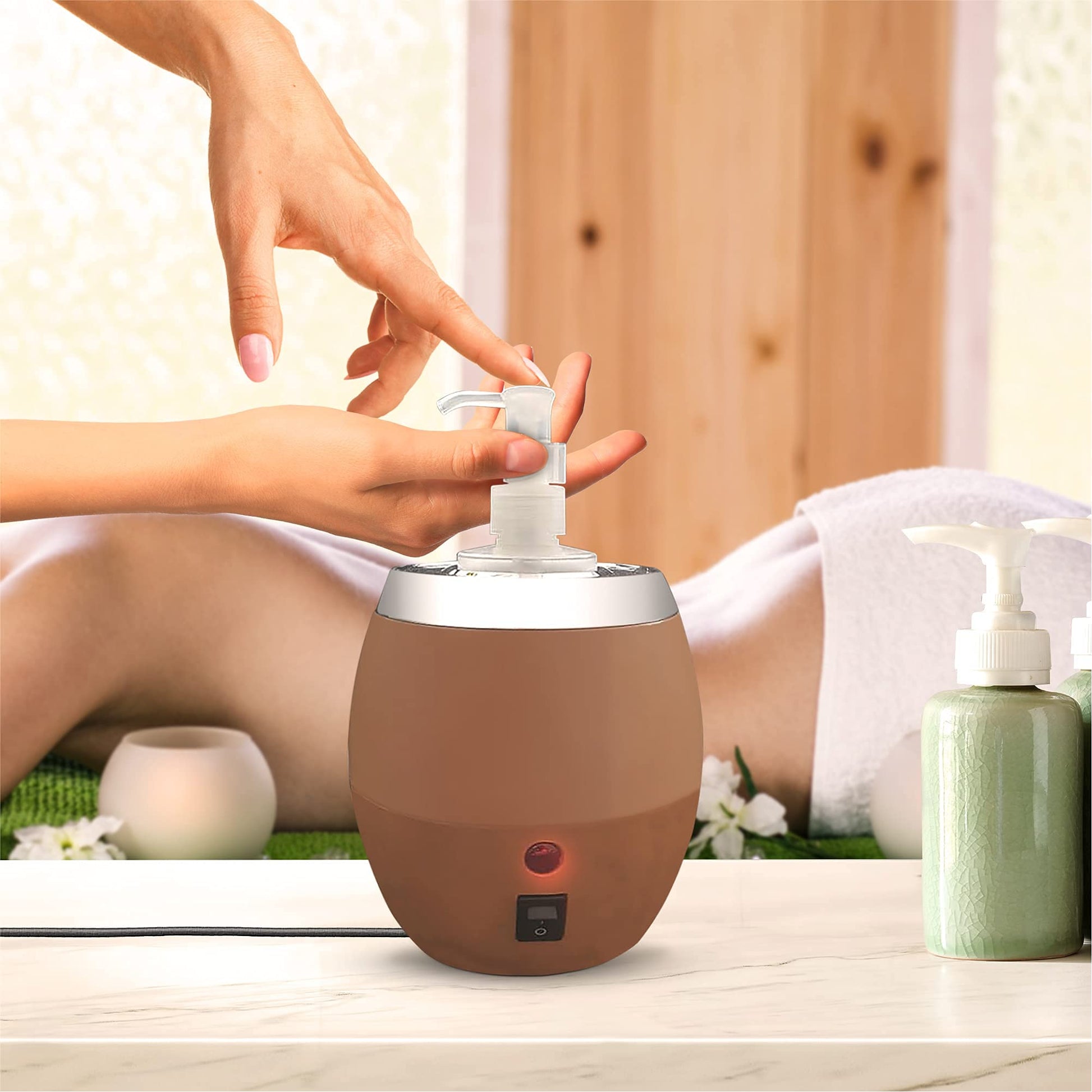 Hand applying lotion to a brown bottle with a blurred background